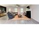 Cozy living room featuring a decorative fireplace, ceiling fan, and lots of natural light at 4417 Village Square Ln, Stone Mountain, GA 30083
