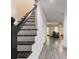 Elegant staircase with modern black railings, seamlessly connecting the home's levels at 4417 Village Square Ln, Stone Mountain, GA 30083