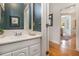 Bathroom with a single sink vanity and dark green walls at 1260 Monroe Ne Dr, Atlanta, GA 30306