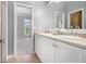 Bright bathroom featuring double sinks and a view into the bedroom at 1260 Monroe Ne Dr, Atlanta, GA 30306