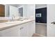 Bright bathroom featuring double sinks and access to the bedroom at 1260 Monroe Ne Dr, Atlanta, GA 30306