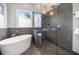 Modern bathroom with a soaking tub, a shower, and sleek fixtures at 1260 Monroe Ne Dr, Atlanta, GA 30306