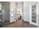 Modern bathroom with walk-in shower, gray tile, and access to the main bedroom at 1260 Monroe Ne Dr, Atlanta, GA 30306
