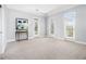 Large bedroom featuring french doors, carpet flooring, and neutral color palette at 1260 Monroe Ne Dr, Atlanta, GA 30306