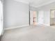 Bright bedroom features neutral walls and access to hallway and bath at 1260 Monroe Ne Dr, Atlanta, GA 30306