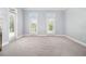 Spacious bedroom with plush carpet and french doors offering ample natural light at 1260 Monroe Ne Dr, Atlanta, GA 30306