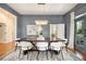 Elegant dining room featuring a modern chandelier, stylish chairs, and beautiful hardwood floors at 1260 Monroe Ne Dr, Atlanta, GA 30306