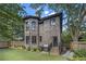 Elegant brick home exterior with well-manicured lawn, patio, and professional landscaping at 1260 Monroe Ne Dr, Atlanta, GA 30306