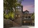 Stunning elevation of brick home with multi-level decks and grand staircase, complemented by a convenient garage at 1260 Monroe Ne Dr, Atlanta, GA 30306