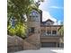Stunning elevation of brick home with multi-level decks and grand staircase, complemented by a convenient garage at 1260 Monroe Ne Dr, Atlanta, GA 30306