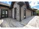 Home exterior featuring a wooden deck and stone and vinyl siding at 1260 Monroe Ne Dr, Atlanta, GA 30306