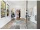 Bright, spacious foyer boasts elegant tile flooring, statement rug, modern lighting, and ample natural light at 1260 Monroe Ne Dr, Atlanta, GA 30306