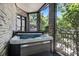 Relaxing hot tub on a private terrace with brick surround offering a serene retreat at 1260 Monroe Ne Dr, Atlanta, GA 30306