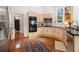 Modern kitchen with stainless steel appliances, light wood cabinets, and hardwood flooring at 1260 Monroe Ne Dr, Atlanta, GA 30306