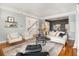 Inviting living area with hardwood floors, contemporary decor, and an open layout connecting to the dining area at 1260 Monroe Ne Dr, Atlanta, GA 30306