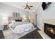 This is a bright main bedroom with a fireplace and dark wood floors at 1260 Monroe Ne Dr, Atlanta, GA 30306