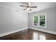 Bedroom with hardwood floors, ceiling fan, and natural light from the window at 1585 Olympian Sw Cir, Atlanta, GA 30310
