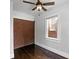 Bedroom featuring a brick wall and a ceiling fan at 1585 Olympian Sw Cir, Atlanta, GA 30310