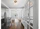Open kitchen with stainless steel refrigerator and range extends into a large living space at 1585 Olympian Sw Cir, Atlanta, GA 30310