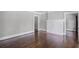 Bright and airy living room featuring a decorative fireplace, hardwood floors, and neutral paint at 1585 Olympian Sw Cir, Atlanta, GA 30310