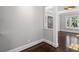 Neutral living room features hardwood floors and white trim at 1585 Olympian Sw Cir, Atlanta, GA 30310