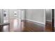 Spacious living room showcasing hardwood floors, neutral paint, and elegant French doors at 1585 Olympian Sw Cir, Atlanta, GA 30310