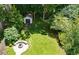 This backyard features a stone fire pit, a storage building, a well maintained yard and plenty of privacy at 2545 Tilson Se Dr, Atlanta, GA 30317
