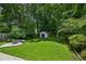 Lush backyard features a well-maintained lawn and a charming fire pit area for outdoor gatherings at 2545 Tilson Se Dr, Atlanta, GA 30317