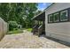 Backyard features a fire pit area, mature trees, and lush landscaping for a private outdoor oasis at 2545 Tilson Se Dr, Atlanta, GA 30317