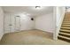 Unfinished basement featuring neutral carpet and bright lights at 2545 Tilson Se Dr, Atlanta, GA 30317