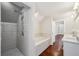 Large bathroom with a walk-in shower, soaking tub, and double sink vanity at 2545 Tilson Se Dr, Atlanta, GA 30317