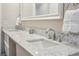 Close up of bathroom showcasing marble countertop with dual sinks and chrome fixtures at 2545 Tilson Se Dr, Atlanta, GA 30317