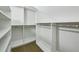 Walk-in closet features custom shelving and ample storage space for a well-organized wardrobe at 2545 Tilson Se Dr, Atlanta, GA 30317