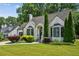 Charming home featuring a brick facade, manicured lawn, and lush landscaping at 2545 Tilson Se Dr, Atlanta, GA 30317
