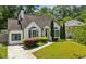 Charming home with manicured lawn, professional landscaping, a stone walkway and a driveway, perfect for suburban living at 2545 Tilson Se Dr, Atlanta, GA 30317