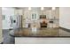 Contemporary kitchen boasting granite countertops, stainless steel appliances, and pendant lighting at 2545 Tilson Se Dr, Atlanta, GA 30317