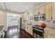 Lovely updated kitchen area with stainless appliances and view of living space and breakfast nook at 2545 Tilson Se Dr, Atlanta, GA 30317