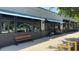 Exterior view of Poor Hendrix Bar or Restaurant showcasing modern design, large windows, and comfortable outdoor benches at 2545 Tilson Se Dr, Atlanta, GA 30317