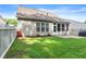 Spacious backyard featuring a well-maintained lawn, patio area, and privacy fencing for outdoor gatherings at 3427 Hampreston Nw Way, Kennesaw, GA 30144