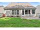 Landscaped backyard with lush grass, patio, and privacy fence offering a serene outdoor space at 3427 Hampreston Nw Way, Kennesaw, GA 30144