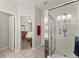 Bathroom showcasing a glass shower and an open doorway into a bedroom at 3427 Hampreston Nw Way, Kennesaw, GA 30144