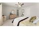 Bright bedroom featuring a cozy bed, a dresser, and a neutral color palette at 3427 Hampreston Nw Way, Kennesaw, GA 30144