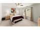 Comfortable bedroom with a ceiling fan, windows, and a cozy bed with decorative pillows at 3427 Hampreston Nw Way, Kennesaw, GA 30144