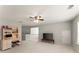Bright bonus room with a ceiling fan, featuring a desk, computer, and a television for versatile use at 3427 Hampreston Nw Way, Kennesaw, GA 30144