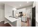 Stylish kitchen featuring white cabinets, stainless steel appliances, and quartz countertops at 3427 Hampreston Nw Way, Kennesaw, GA 30144