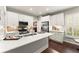 Modern kitchen featuring white cabinets, stainless steel appliances, quartz countertops and mosaic backsplash at 3427 Hampreston Nw Way, Kennesaw, GA 30144