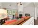 Spacious living room featuring hardwood floors, fireplace and mantel, and sliding glass doors to porch at 3427 Hampreston Nw Way, Kennesaw, GA 30144