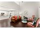 Open-concept living room connecting to kitchen and breakfast nook; hardwood floors and neutral tones at 3427 Hampreston Nw Way, Kennesaw, GA 30144