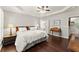 Comfortable main bedroom with hardwood floors, tray ceiling, and abundant natural light at 3427 Hampreston Nw Way, Kennesaw, GA 30144