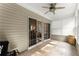 Bright sunroom with a ceiling fan and sliding glass door access to the outdoors at 3427 Hampreston Nw Way, Kennesaw, GA 30144